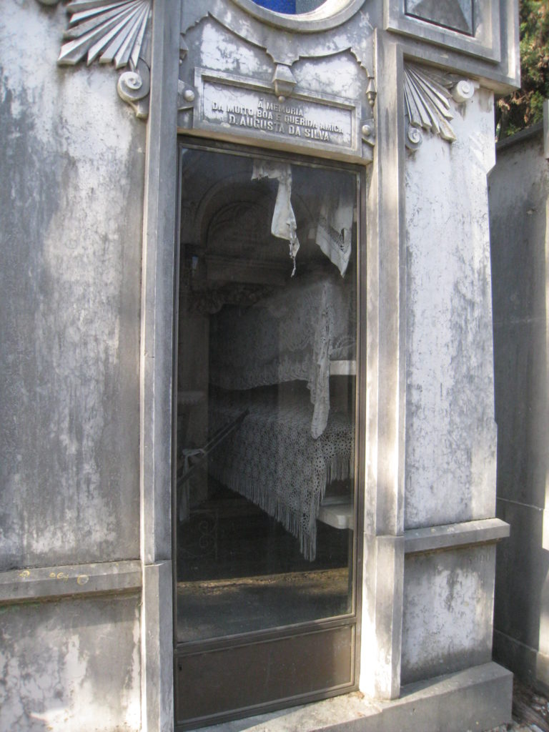 A simple glass fronted tomb in Lisbon